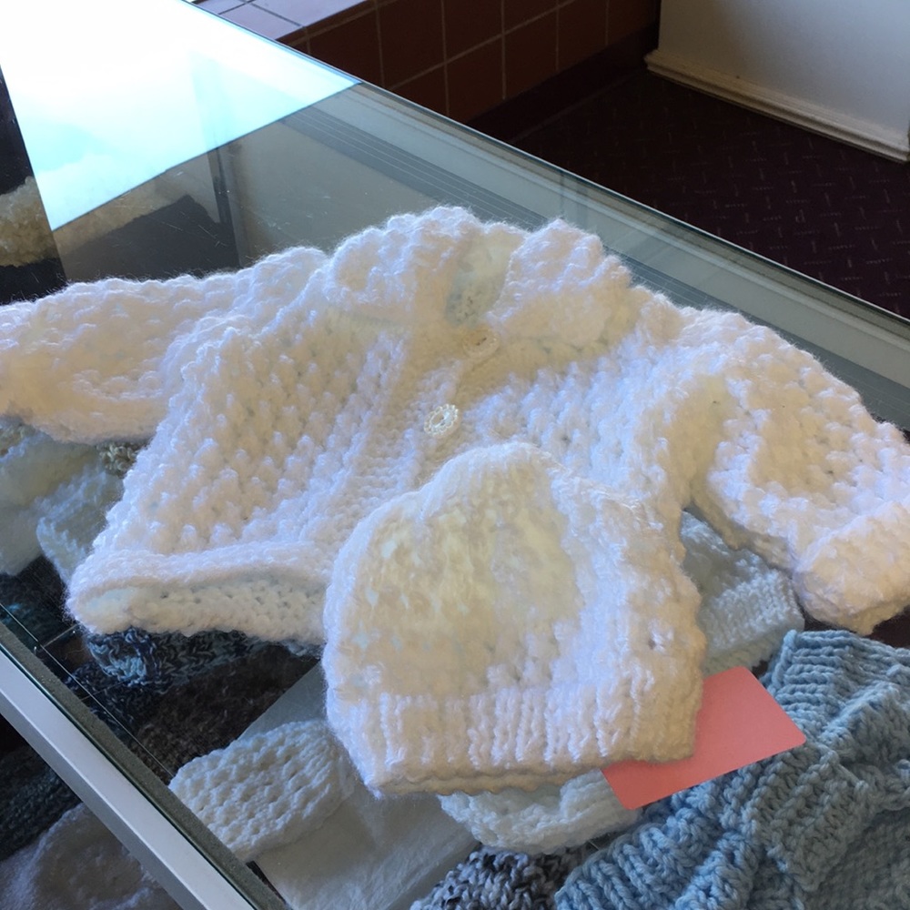 Baby white sweater and hat.